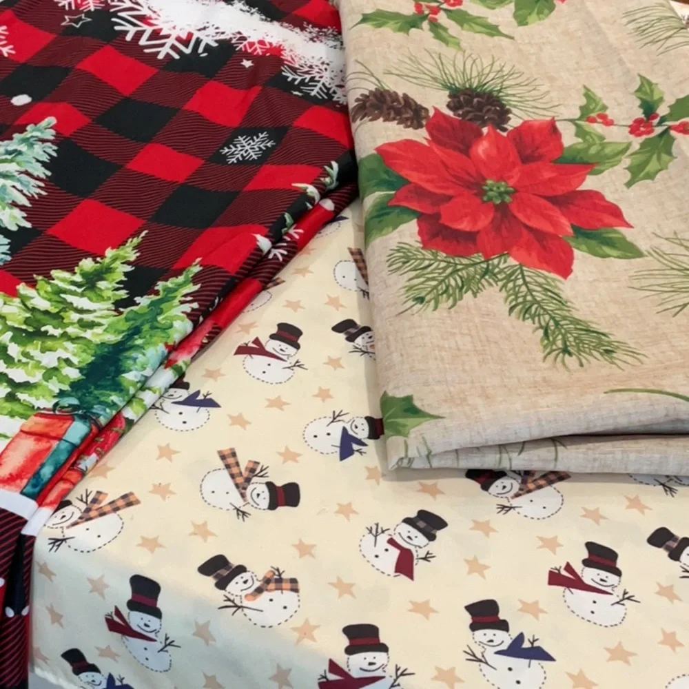 Three Christmas holiday tablecloths